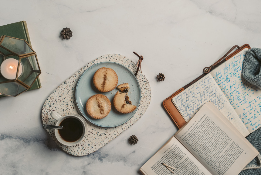 a book, a journal, cookies and tea