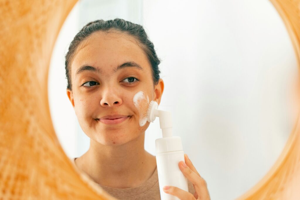 a woman washing her face