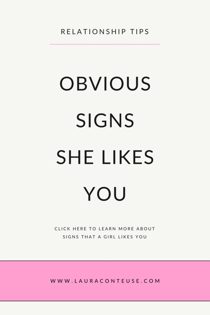a pin that says in a large font signs she likes you