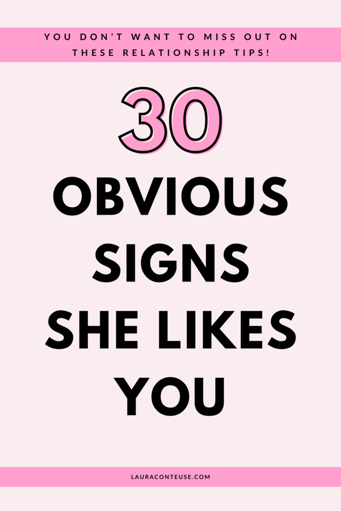 a pin that says in a large font signs she likes you