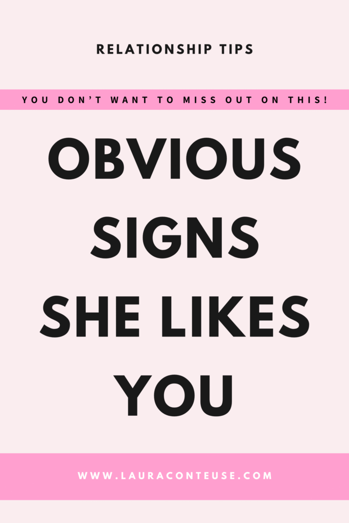 a pin that says in a large font signs she likes you