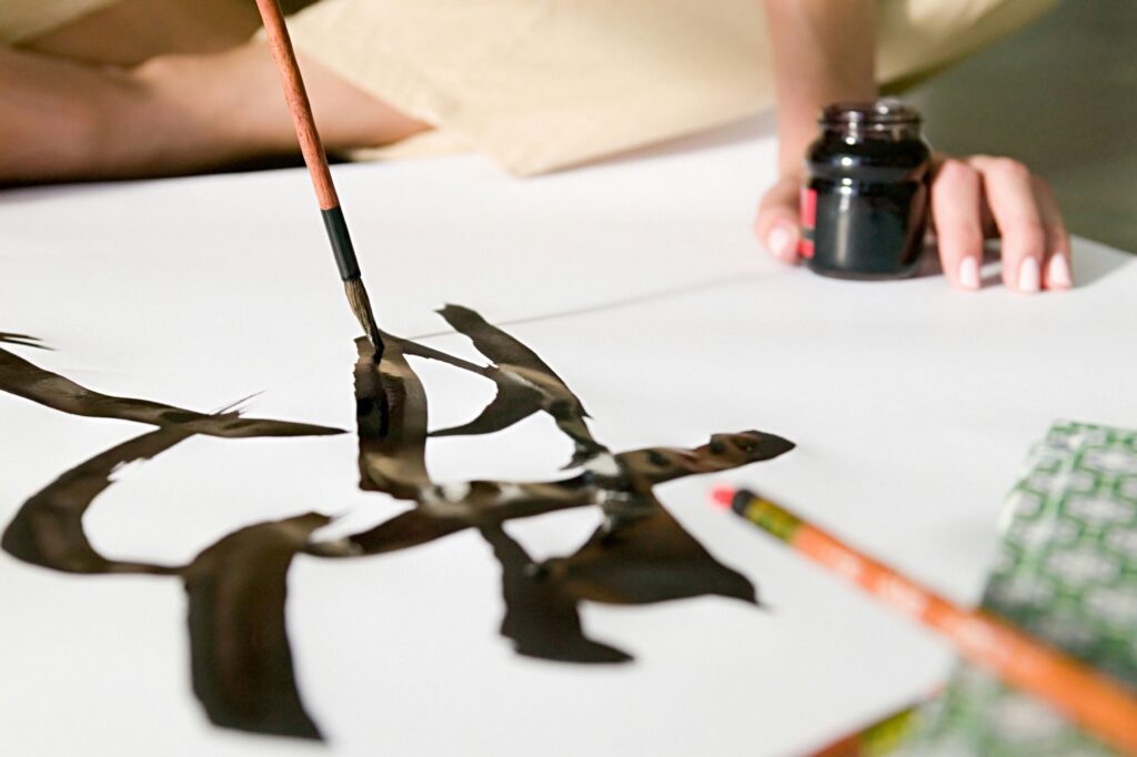 a woman doing calligraphy
