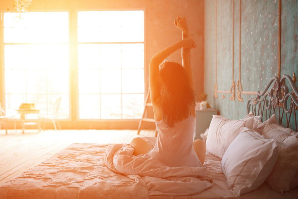 a woman waking up to soft light