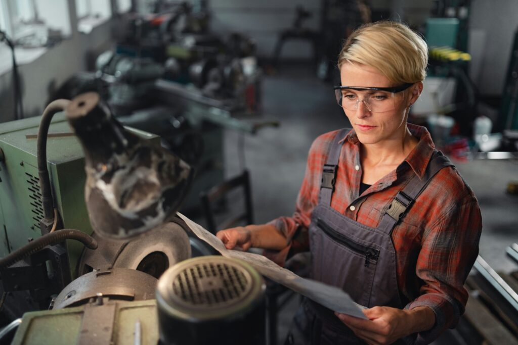 a woman doing some basic appliance maintenance