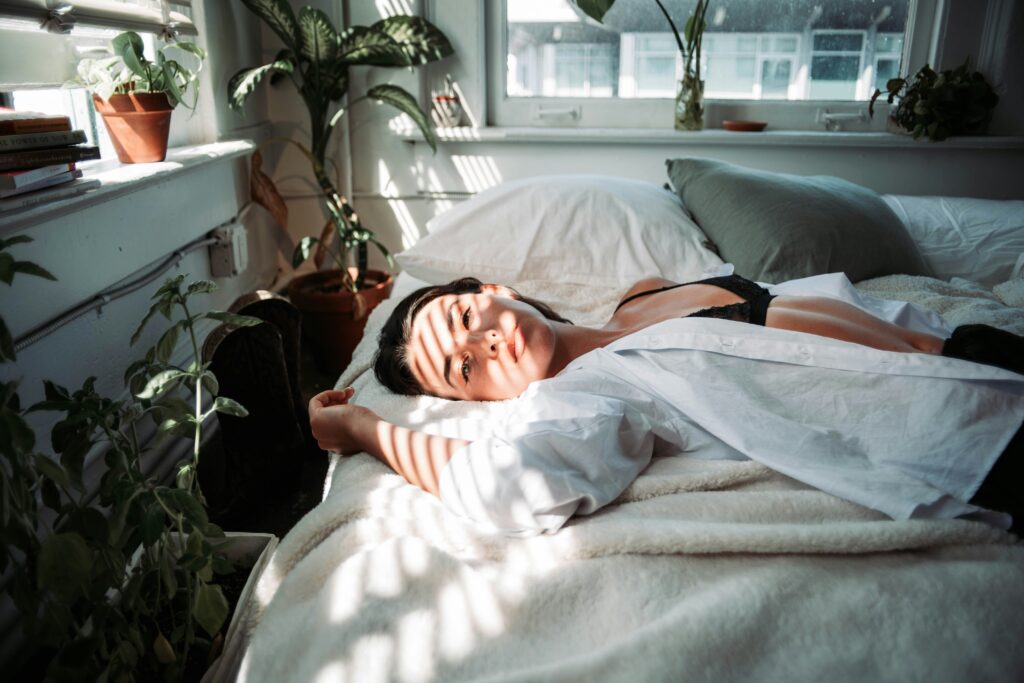 a woman laying in bed